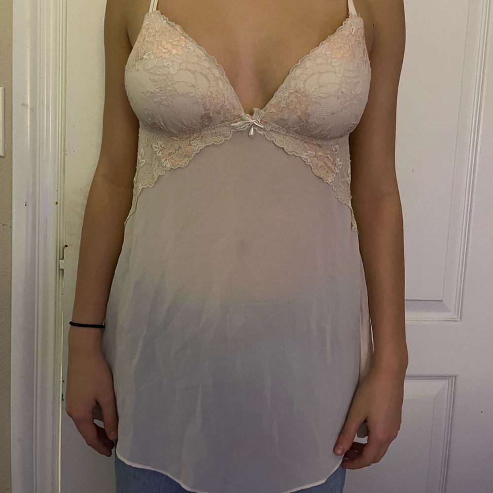 baby pink lingerie top with bow and pearl detail.